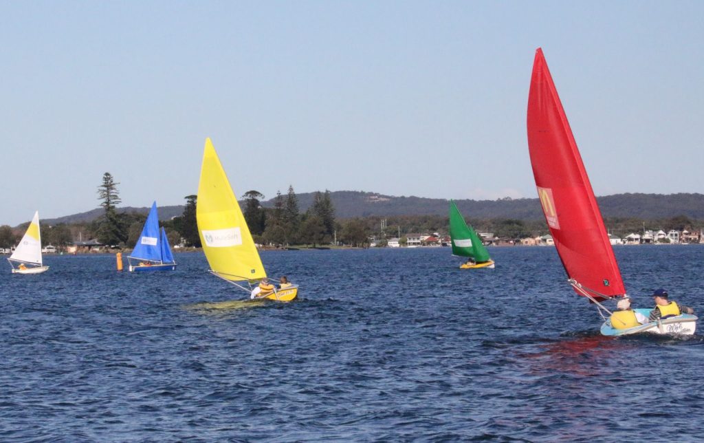 Sailability boats racing to the marker